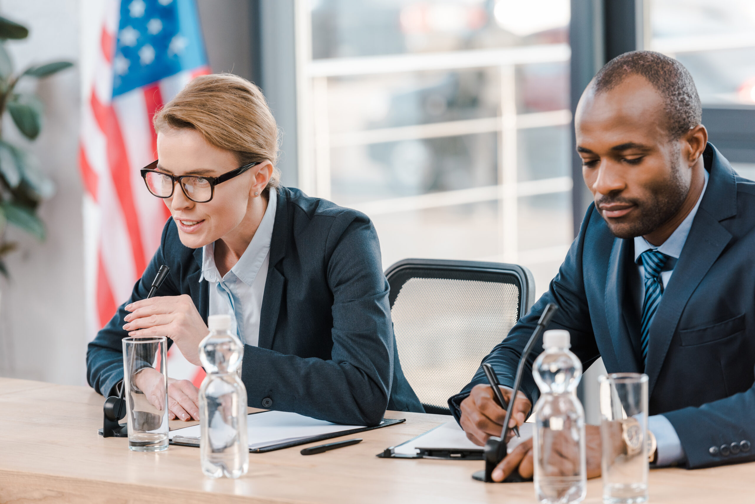 A lawyer and their client discussing a government investigation against the client.