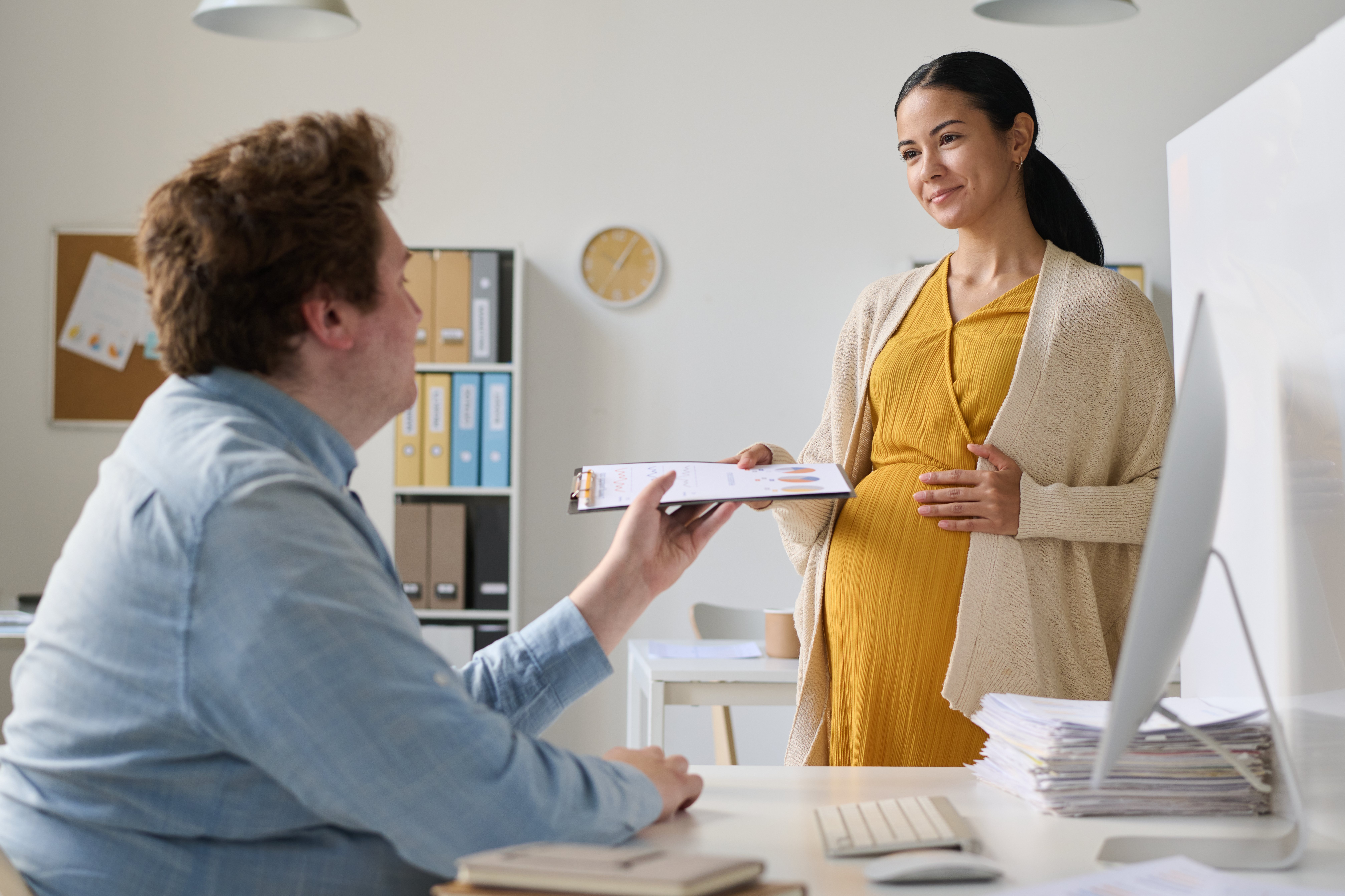 A boss taking steps to make a smooth transition with an employee before they go on FMLA leave while following FMLA guidelines for employers.